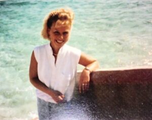 Image of author from 1989 standing next to the ocean.