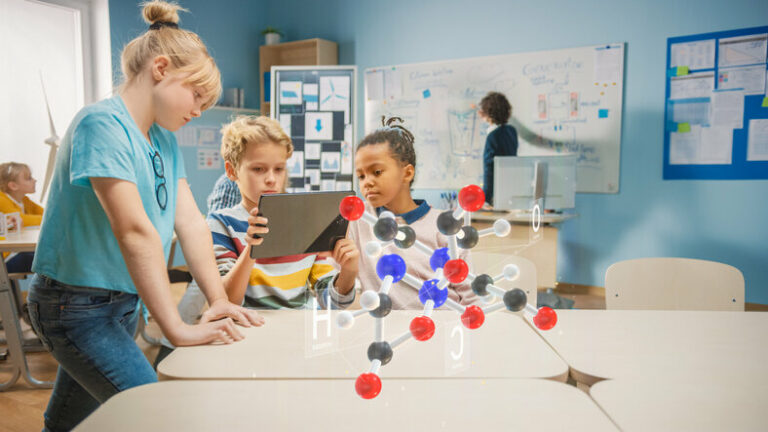 Young students in a science classroom collaborating using a device and Artificial Intelligence.