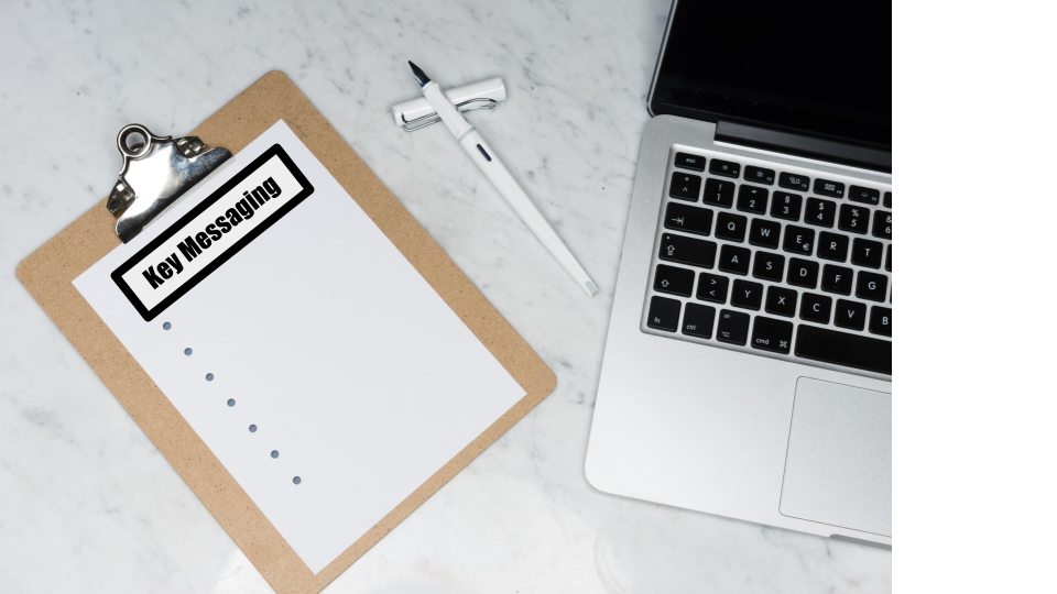 A laptop with a clipboard beside it. The clipboard has a blank checklist entitled Key Messaging.