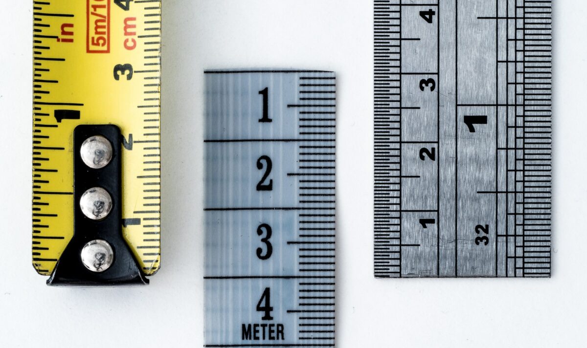 Three different rulers and/or measuring tapes